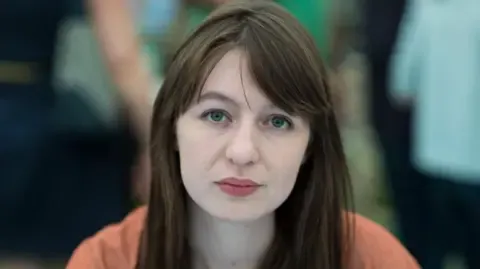 Irish author Sally Rooney claims she cannot enter the UK because of arrest fears